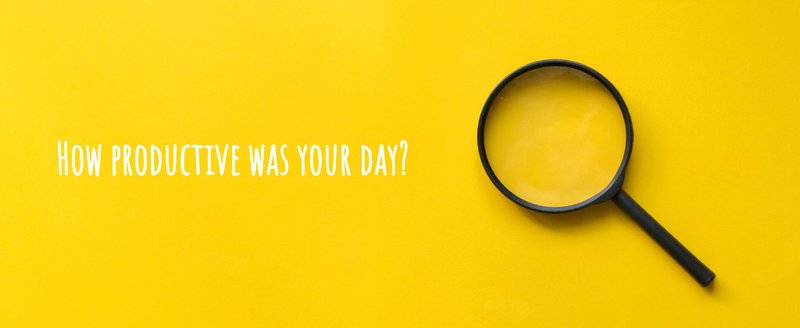 Close up magnifier glass on yellow background for productivity improvement