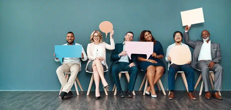 People sitting with chat bubbles