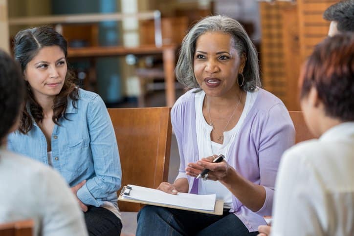 A senior career counselor with her students