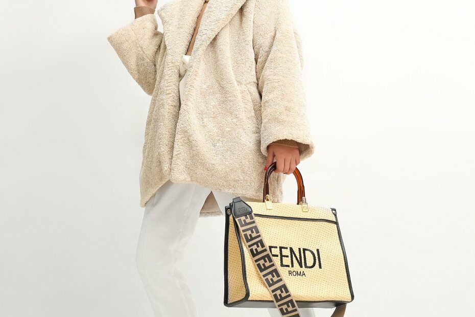 A fashion women holding a fendi purse representing a successful fashion marketing