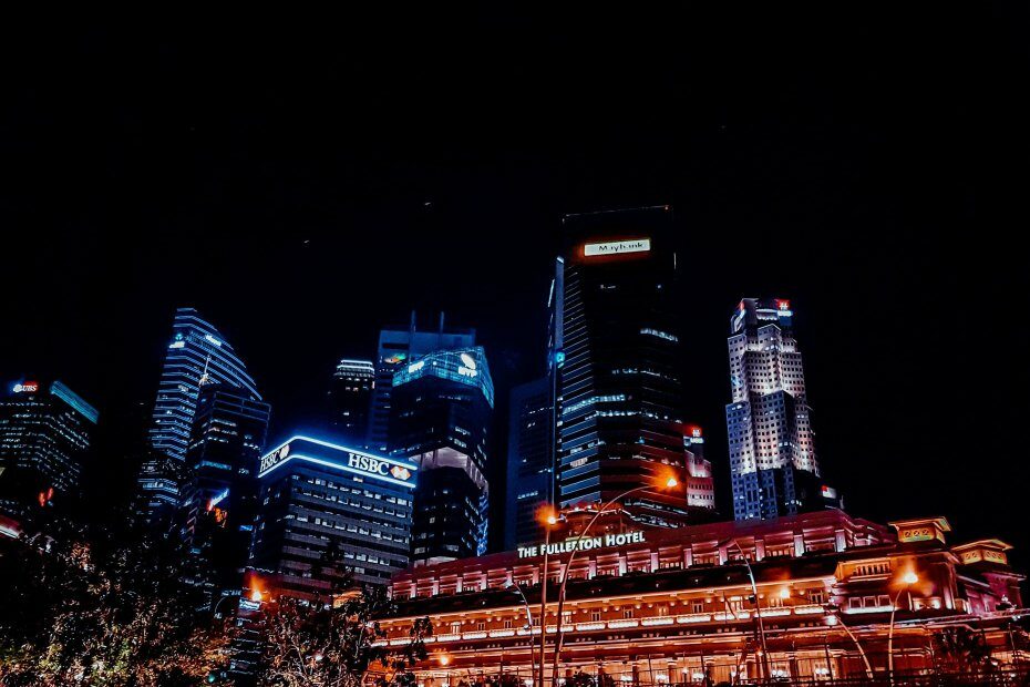 A city vuew at night showing buildings of big banks