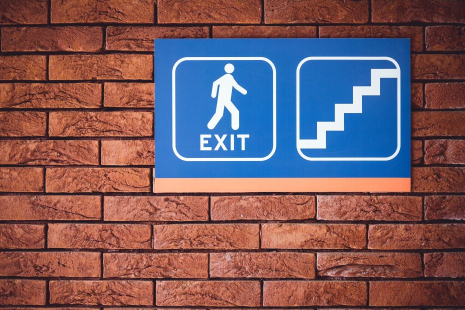 An exit sign representing leaving work early