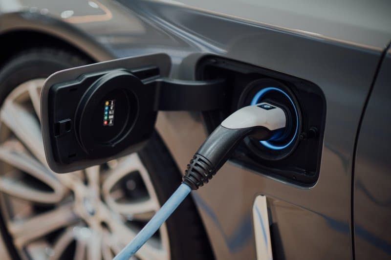 An image of an EV recharging, helping answer the questions if automobile manufacturing is a good career path