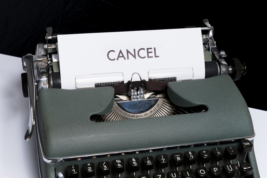A type machine with a cancel note for an interview cancelation